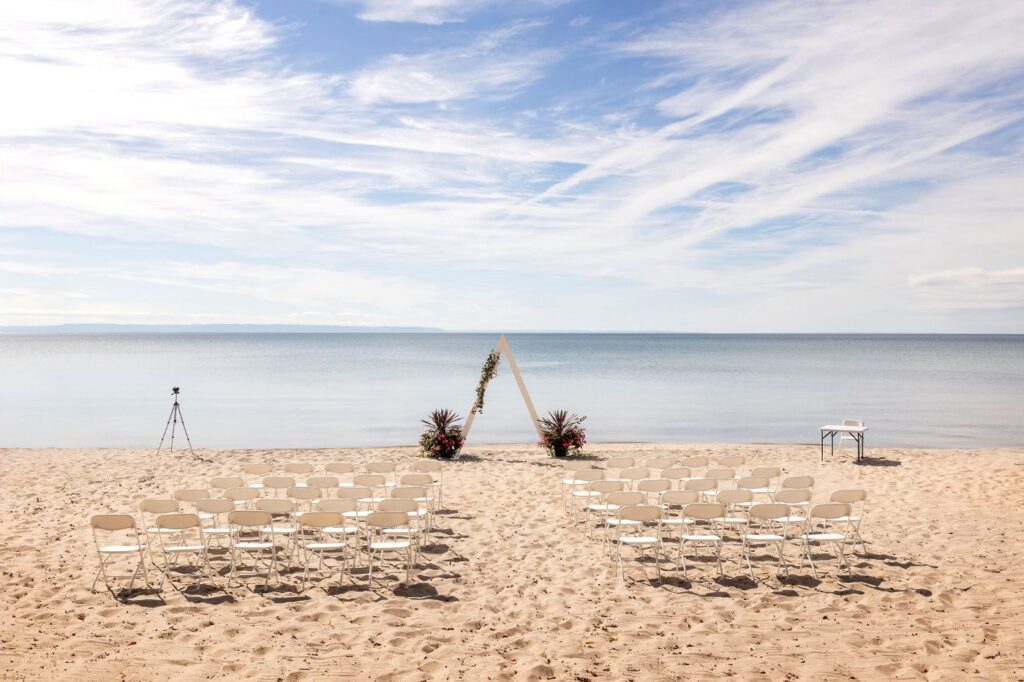 Beachfront wedding ceremony at Experience CARI on Georgian Bay